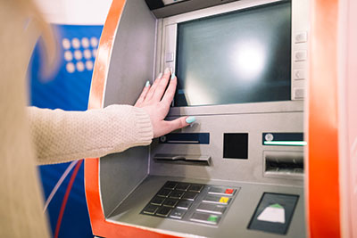 A person using an ATM