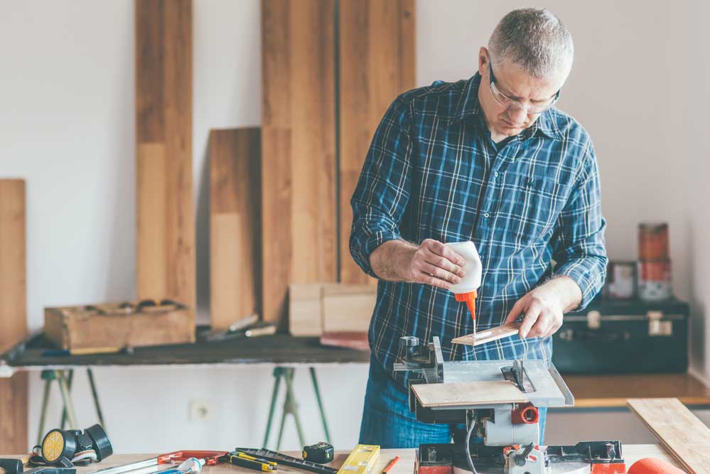 A Technician Applying Glue